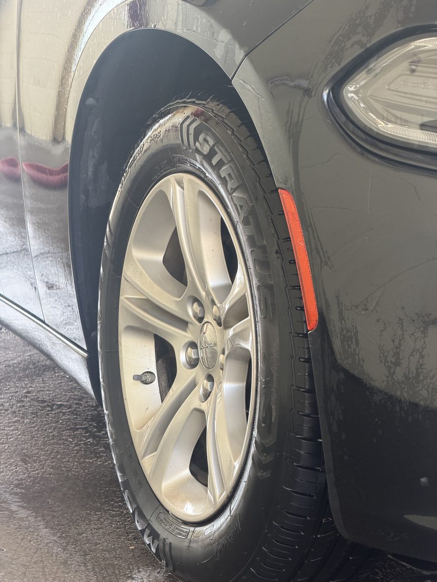 Alloy wheel and tire cleaned and dressed